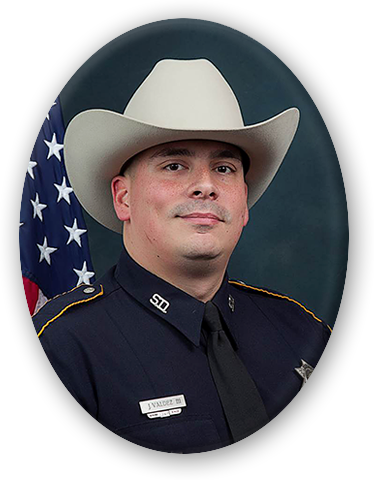 A man in uniform with cowboy hat and american flag.